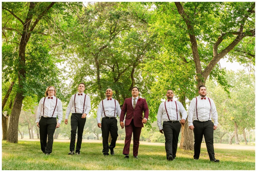 Luis & Keila - Summer wedding 2023 - Les Sherman Park - 17 - Groom & his groomsmen walking through the park