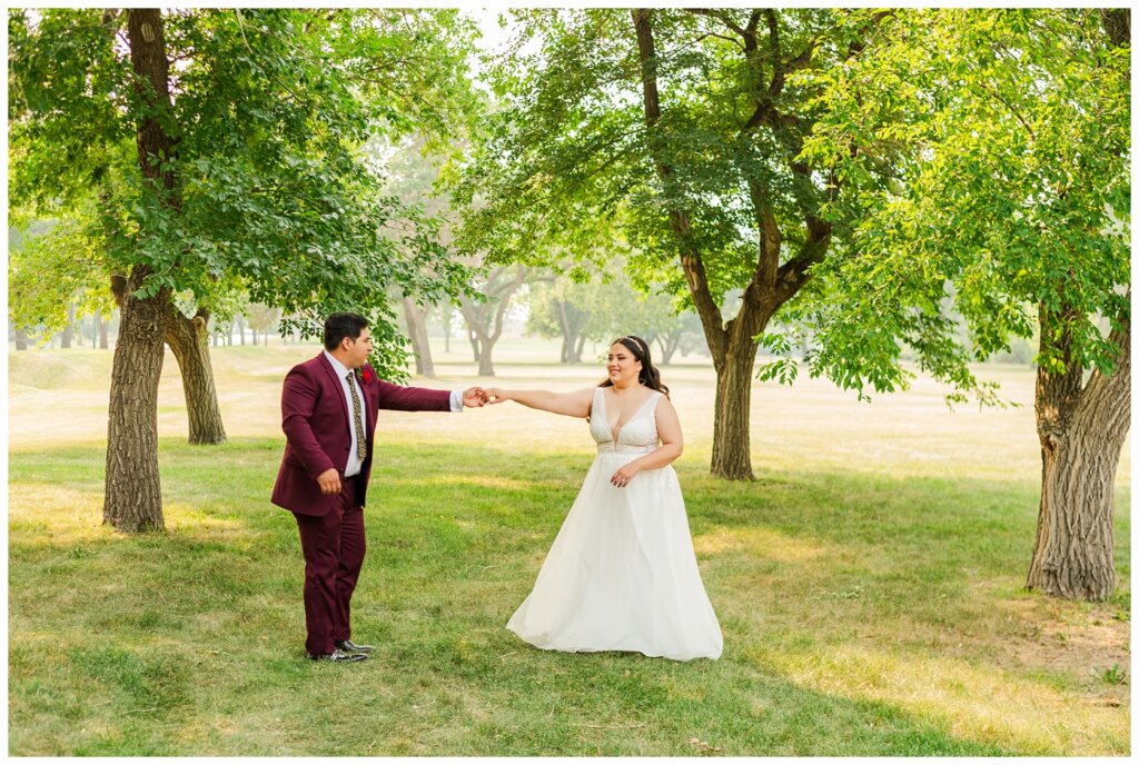 Luis & Keila - Summer wedding 2023 - Les Sherman Park - 18 - Husband twirls his bride