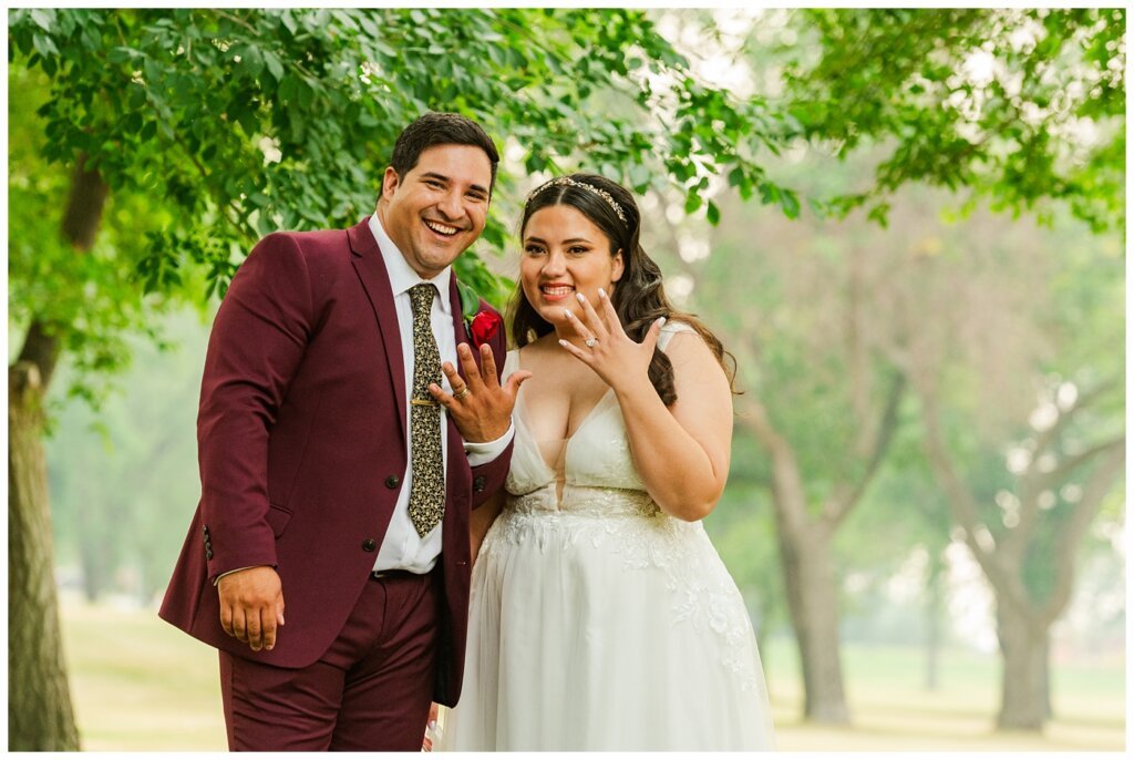 Luis & Keila - Summer wedding 2023 - Les Sherman Park - 19 - The happy couple show off their new bling