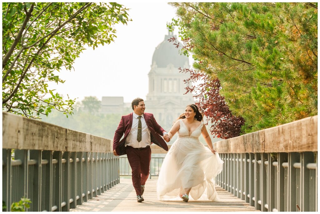 Luis & Keila - Summer wedding 2023 - Trafalgar Overlook - 23 - Bride & groom run down the overlook