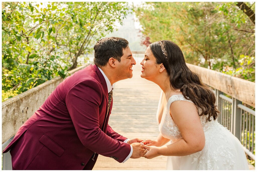 Luis & Keila - Summer wedding 2023 - Trafalgar Overlook - 24 - Bride & groom lean in for a kiss