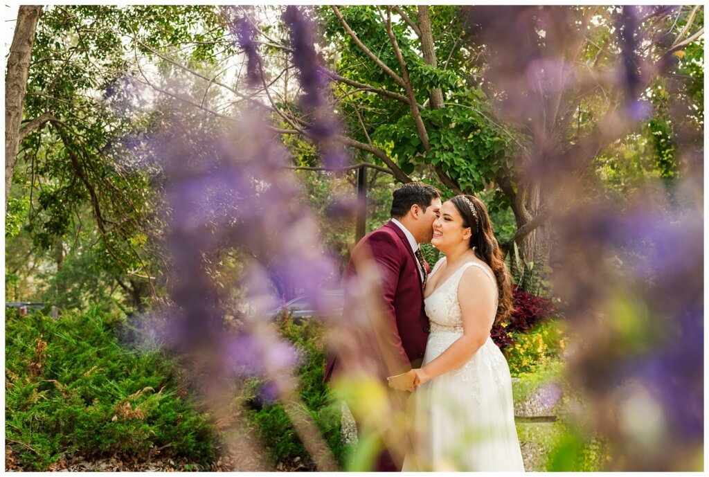 Luis & Keila - Summer wedding 2023 - Trafalgar Overlook - 27 - Groom whispers in his wifes ear