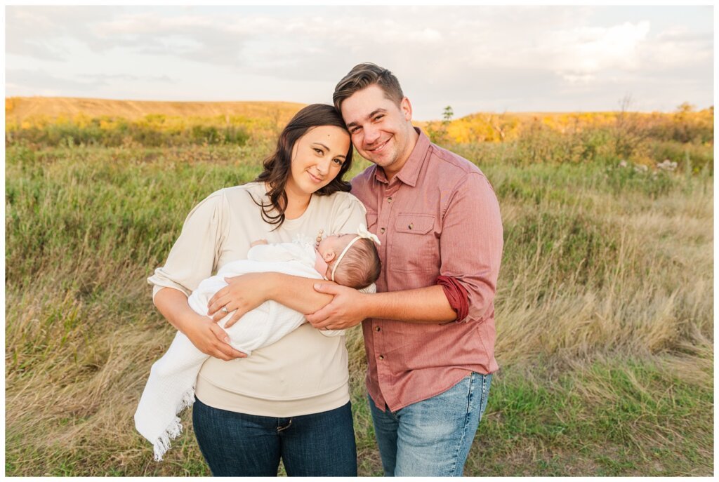 Hachkewich Family - Wascana Trails - 07 - Mother holds baby in tall grass