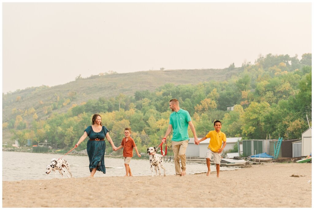 Jaarsma Family - Lumsden Beach - 02 - Family walks down the beach with their Dalmatians