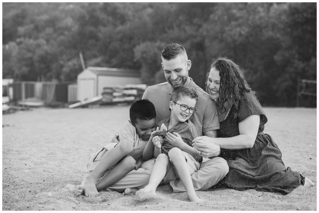 Jaarsma Family - Lumsden Beach - 09 - Family cuddles together on the beach