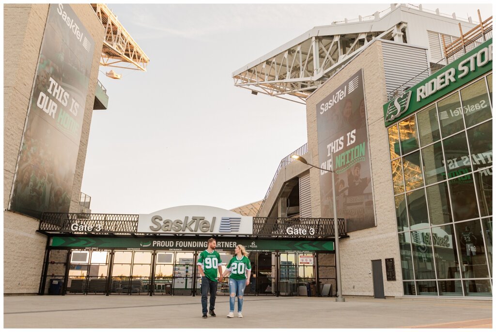 Lindskog Family - Mosaic Stadium - 07 - Couple wears jerseys outside stadium