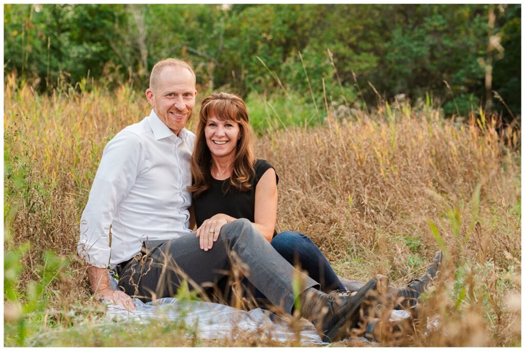 Schoenroth Family - AE Wilson Park - 05 - Couple smiles at the camera