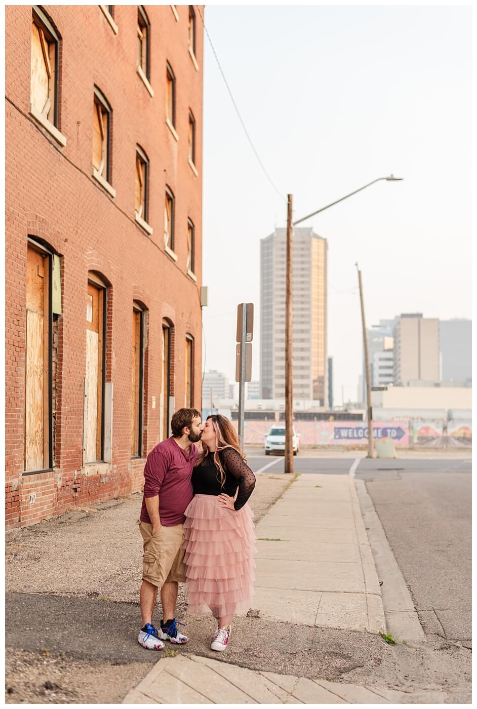 TJ & Danielle - Regina Warehouse District - 12 - Couple kisses in alley