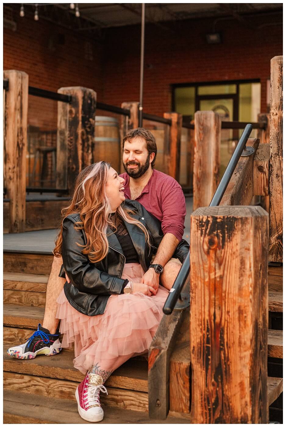TJ & Danielle - Regina Warehouse District - 15 - Couple sits on wooden steps
