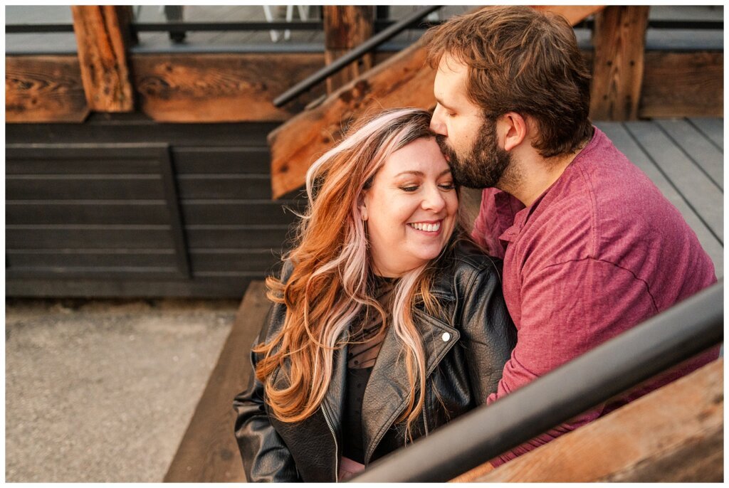 TJ & Danielle - Regina Warehouse District - 16 - Husband kisses his wife on the forehead