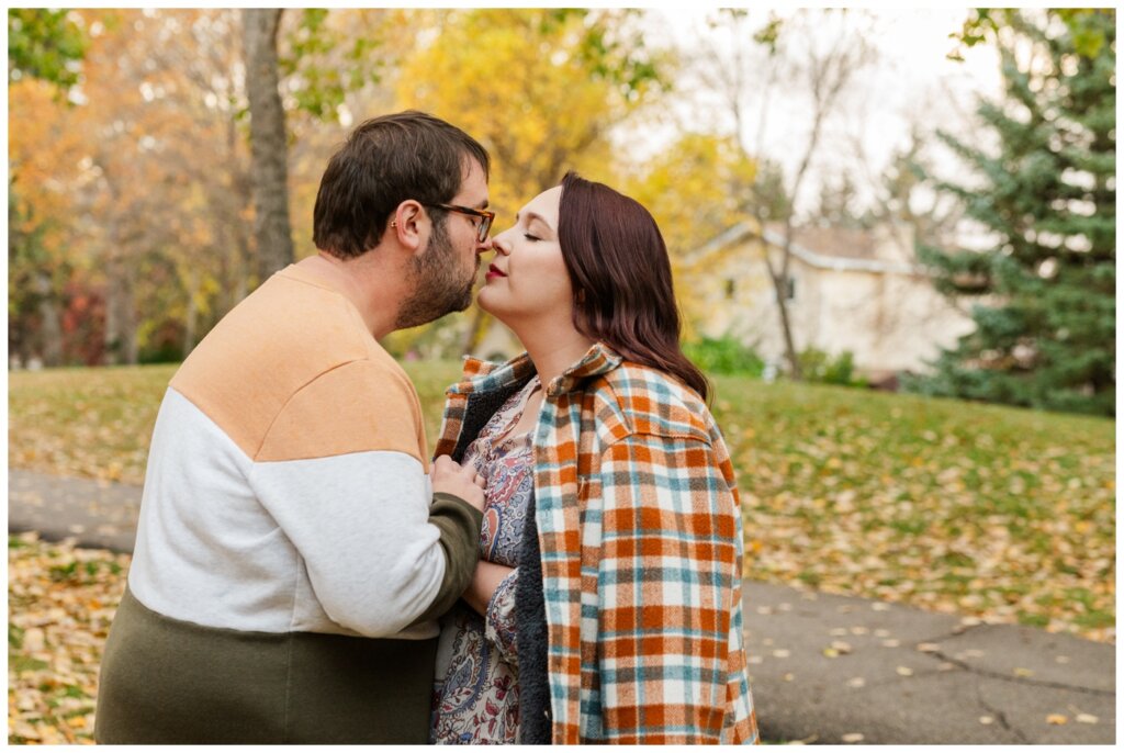 Darren & Amber Engagement - Parkridge Park - 11 - Couple lean in for a kiss