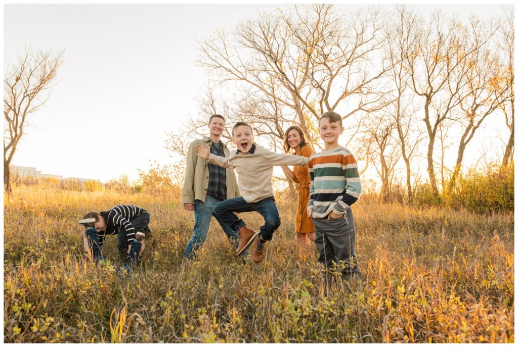 Neufeld Family - Wascana Habitat Conservation Area - 09 - Little boy jumps in family pictures