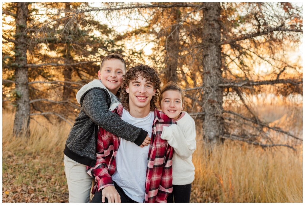 Schlamp Family - 02 - Wascana Park - Siblings in a group hug