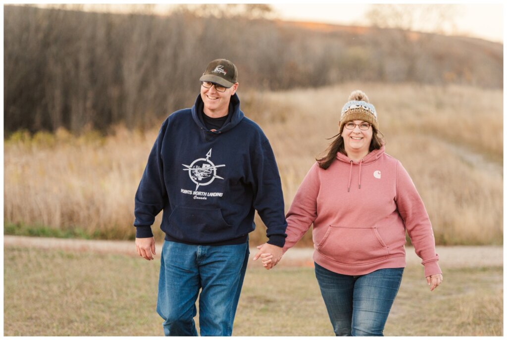 Sheldon & Amy - Wascana Trails - 11 - Woman in pink Carhartt sweater smiles at camera