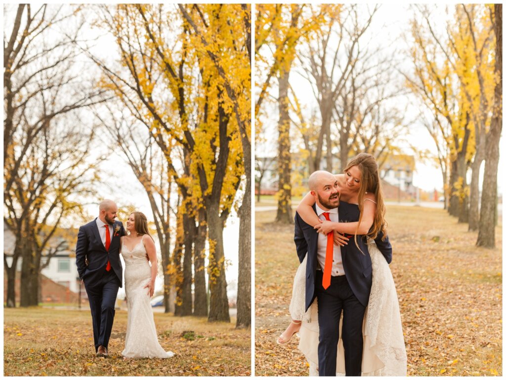 Spencer & Taylor Wedding - 16 - TC Douglas Building - Bride & Groom walking through the fall leaves