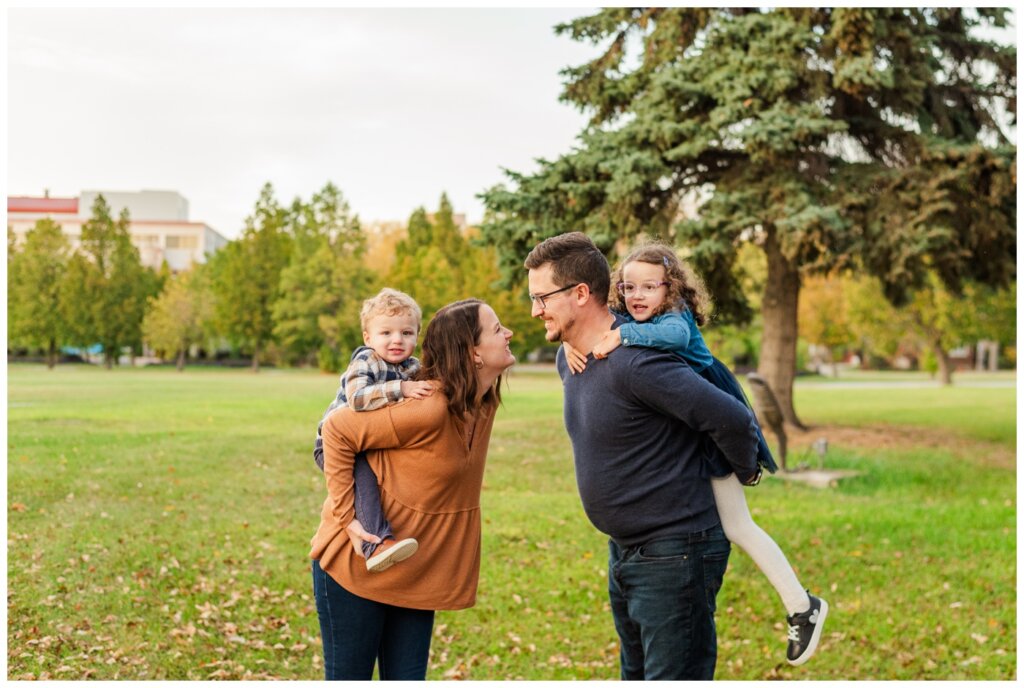 Swereda Family - Royal Saskatchewan Museum - 15 - Mom and dad give kids piggybacks