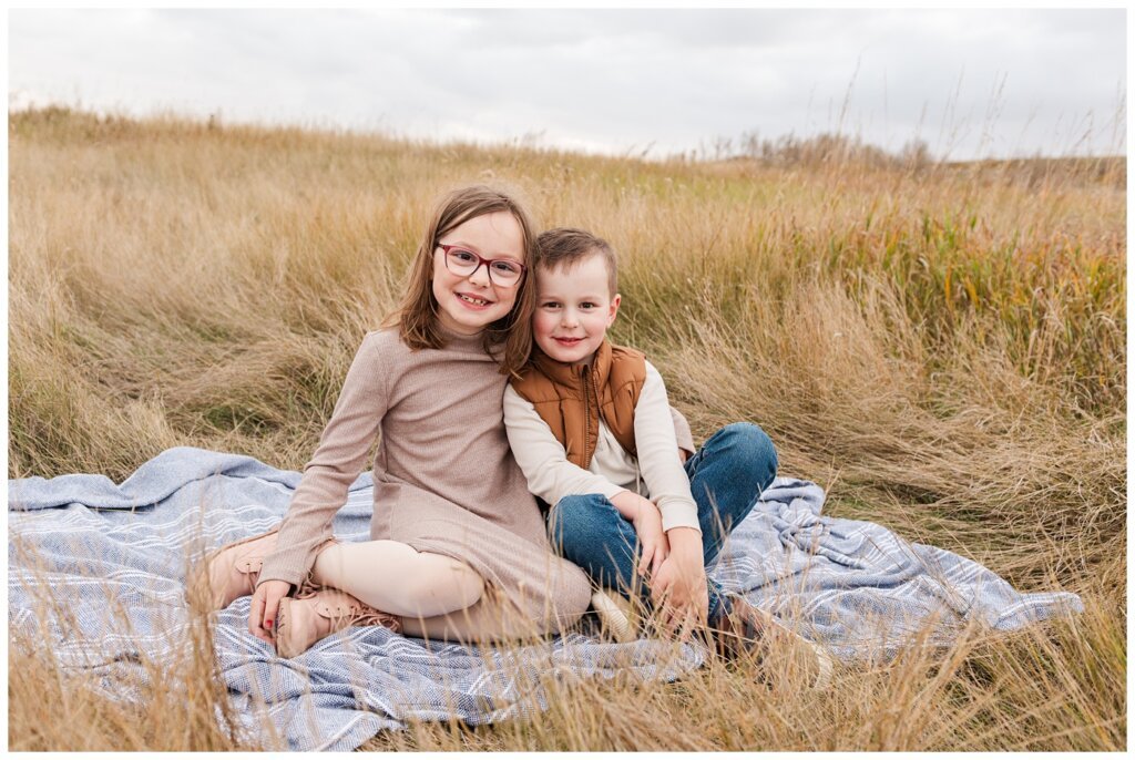 Zurowski Family - Wascana Trails - 09 - Little girl sits on blanket with her brother