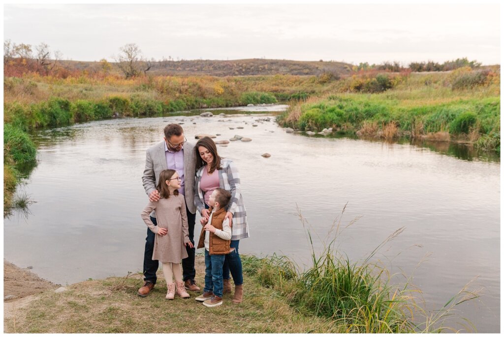 Zurowski Family - Wascana Trails - 11 - Family stands by the creek