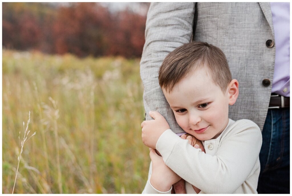 Zurowski Family - Wascana Trails - 13 - Little boy holds tightly to dad