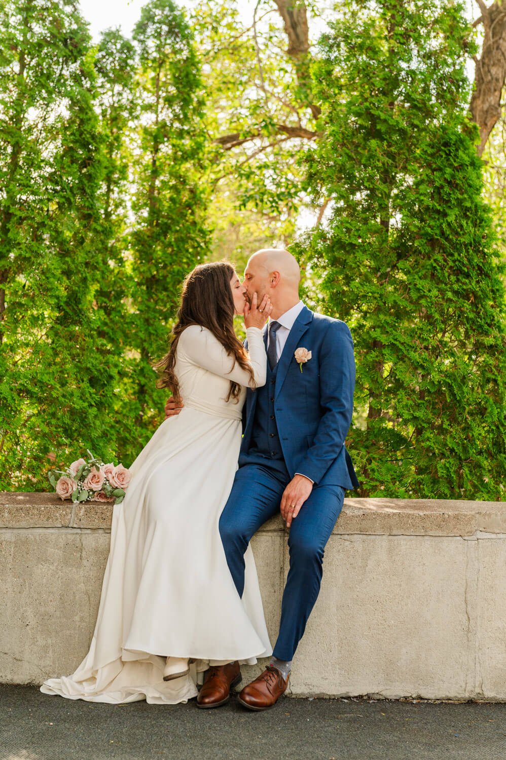 Evan & Chantel - Bride & Groom walking on dock on Wascana Lake in Regina