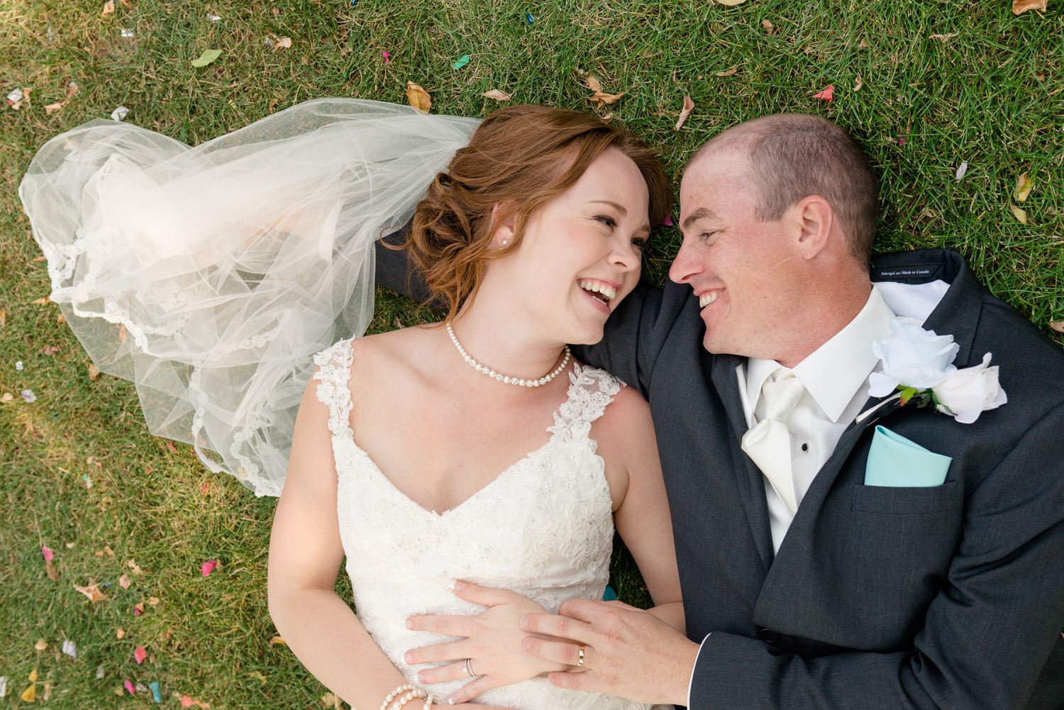 Scott & Keely - Bride & Groom leaning on vintage mustang at black and white wall in Regina