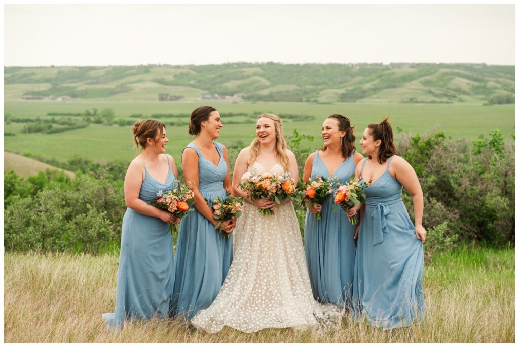 Darcy & Maddie - Regina Summer Wedding - 017 - Goodsman Farm - Bride with bridesmaids in cornflower blue