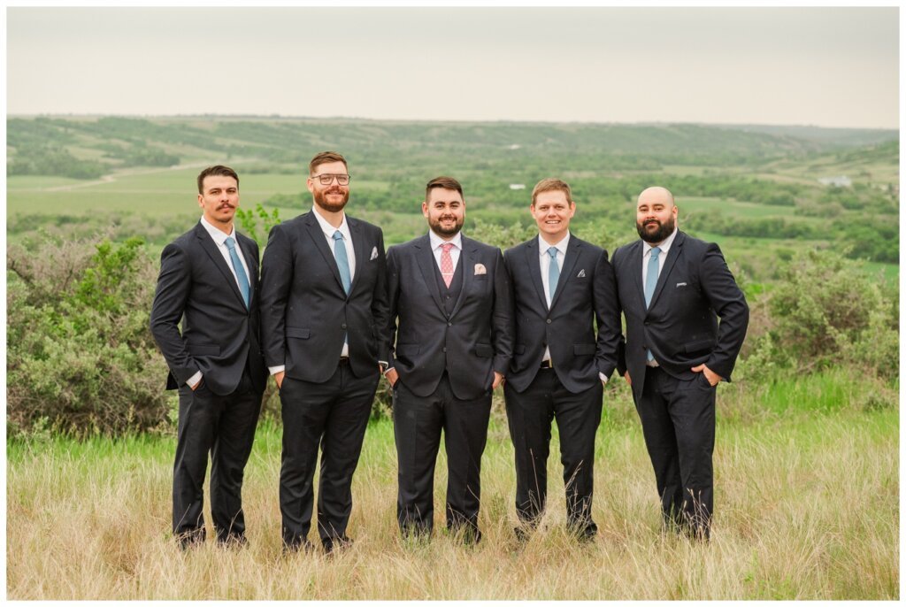 Darcy & Maddie - Regina Summer Wedding - 019 - Goodsman Farm - Groom with groomsmen in dark blue suits