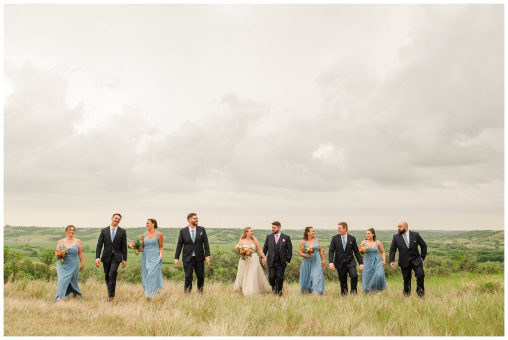 Darcy & Maddie - Regina Summer Wedding - 020 - Goodsman Farm - Wedding party walking together