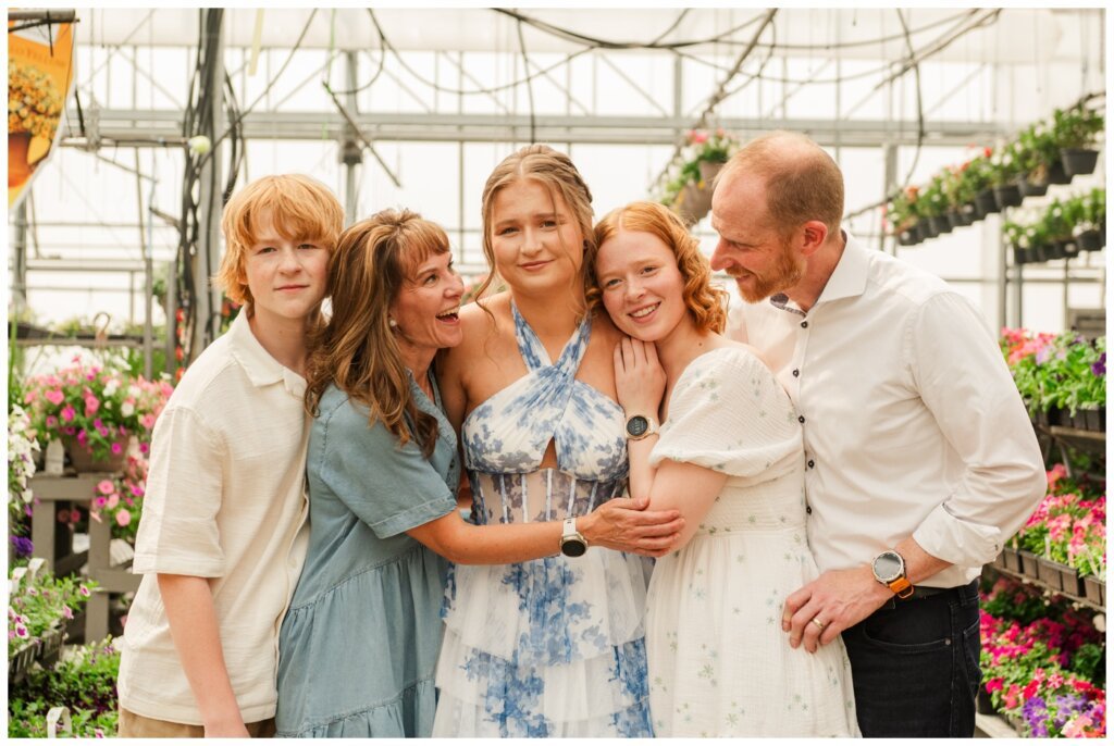 Isabelle Grad 2025 - Dutch Growers Regina - 006 - Family hugs grad