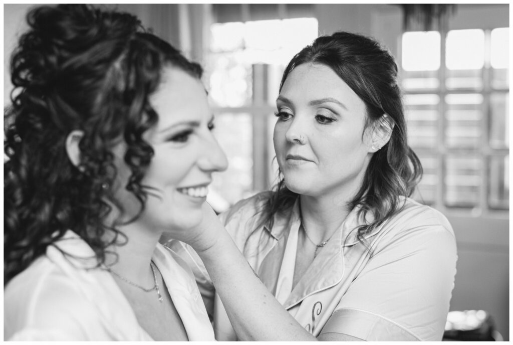 Blayde & Hanna - Regina Wedding Photographer - 007 - Maid of Honour helps bride with jewellery