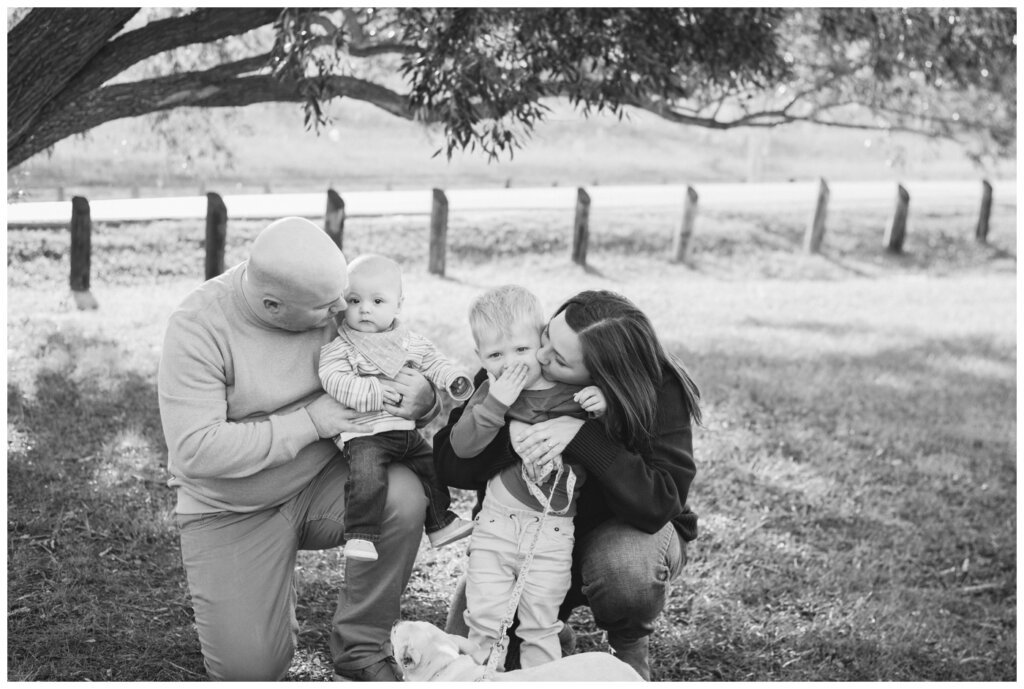Munroe Family - Regina Family Photography - 007 - Mom & dad give their boys kisses
