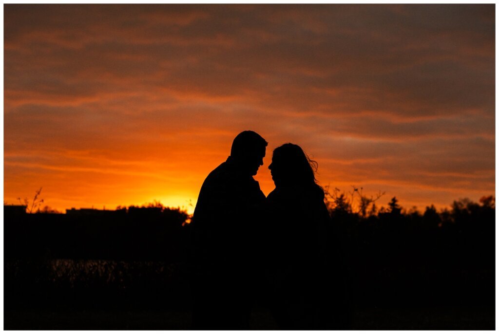 Scott & Ashley - Regina Family Photography - Wascana Park - 007 - Couple silhouette at fall sunset