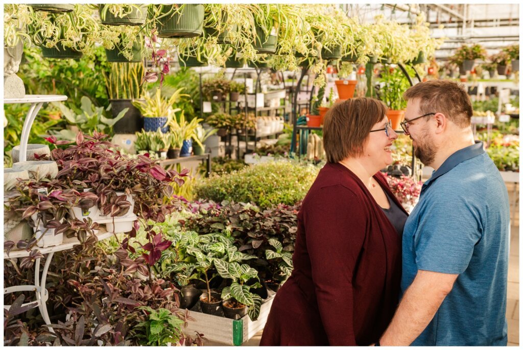 Weir Family - Dutch Growers Regina - 005 - Mom & Dad take a moment to snuggle in the greenhouse